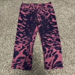 Nike pink and purple athletic capris.